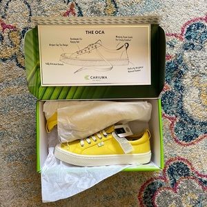 Cariuma yellow sneakers. New in box